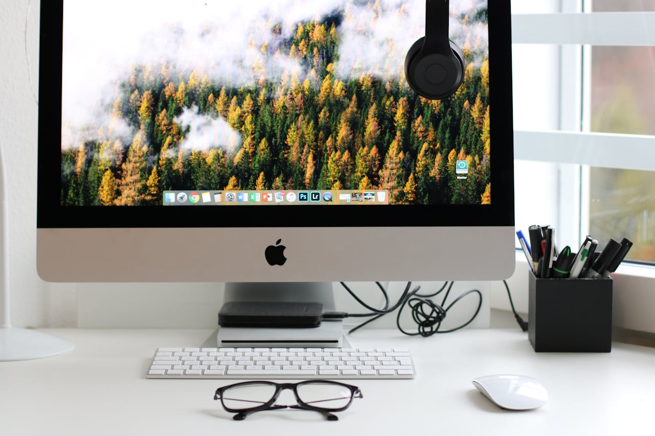 our-story Stylish home office workspace featuring a computer setup with accessories.